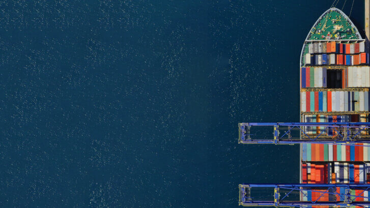 Aerial top down ultra wide photo of industrial container ship lo