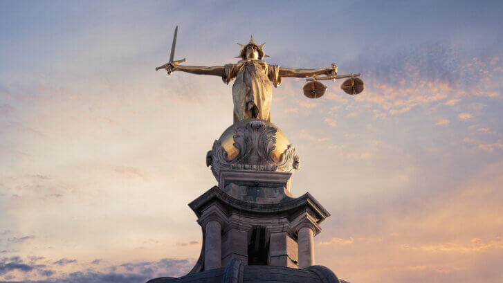 Justice On The Old Bailey, London with a sunset background